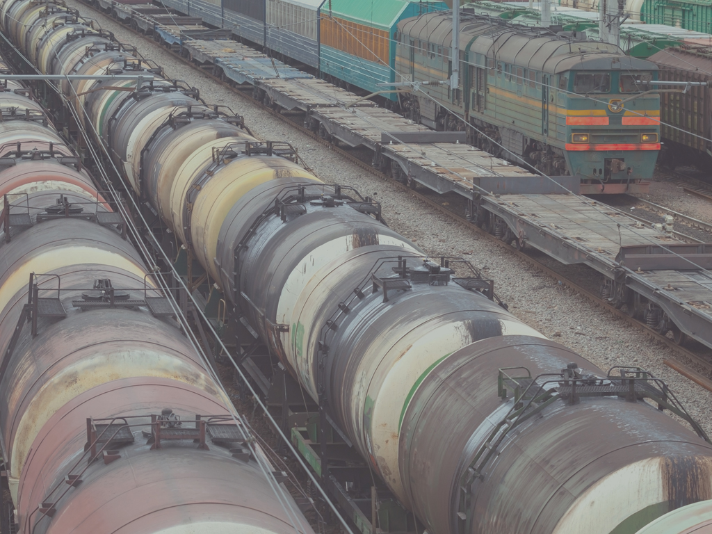 Railroad scene with locomotive and cargo trains